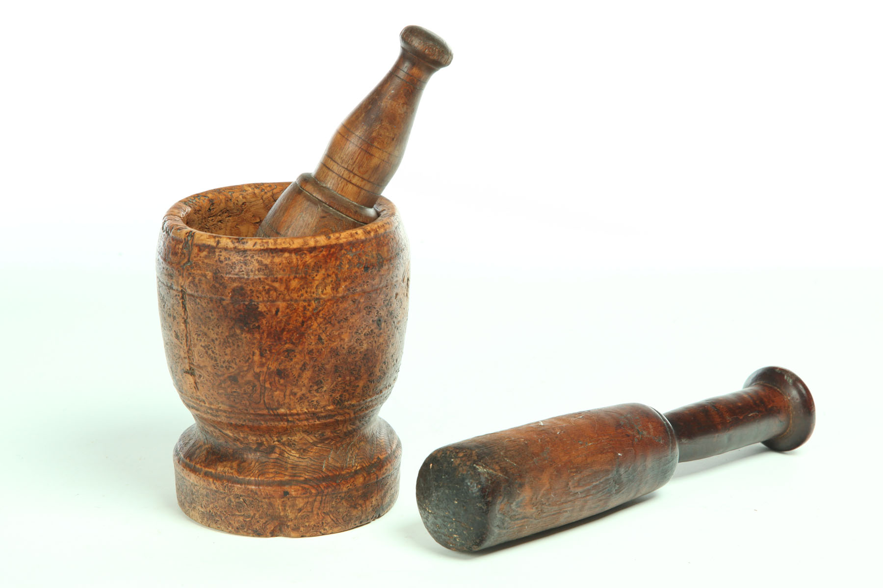 Appraisal: MORTAR AND TWO PESTLES American th century Burl mortar ''h