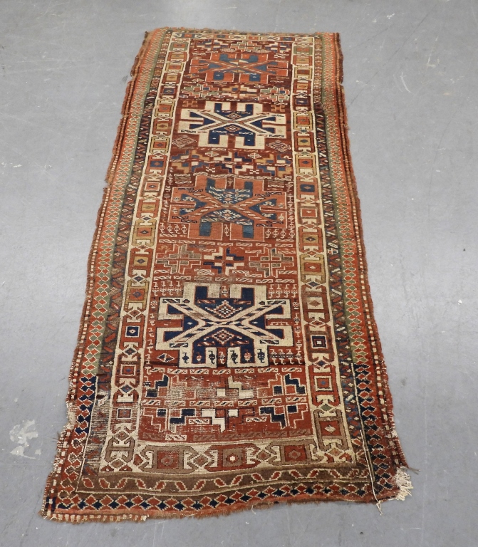 Appraisal: CAUCASIAN RUG Caucuses th CenturyReds blue white and tan repeating