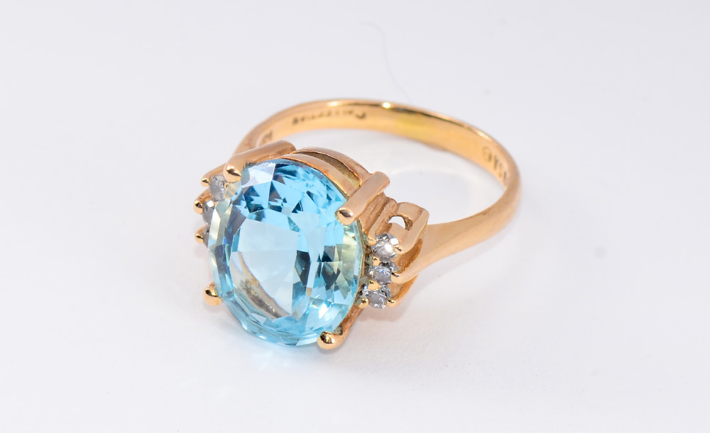 Appraisal: TOPAZ DIAMOND RING K yellow gold ring centers one Ct