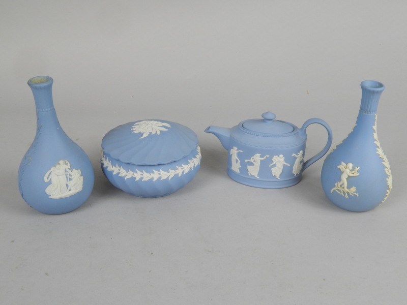 Appraisal: Wedgwood blue Jasperware comprising two similar vases the first decorated