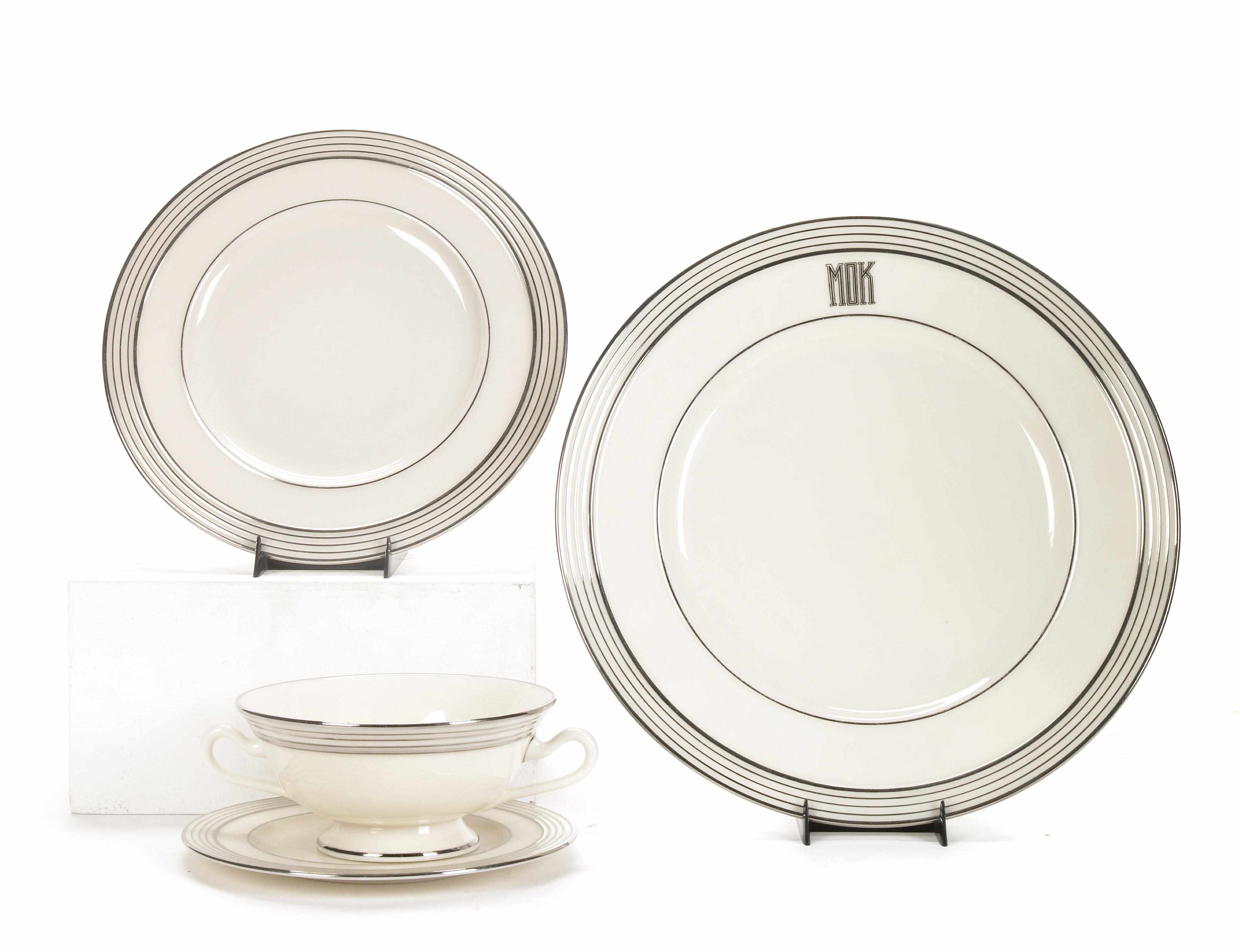 Appraisal: A Lenox part dinner service with concentric silvered orders comprising