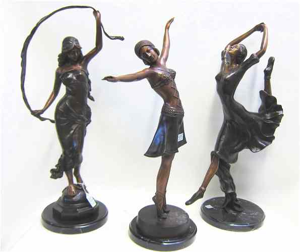 Appraisal: THREE BRONZE FIGURAL SCULPTURES each a posed standing woman Heights