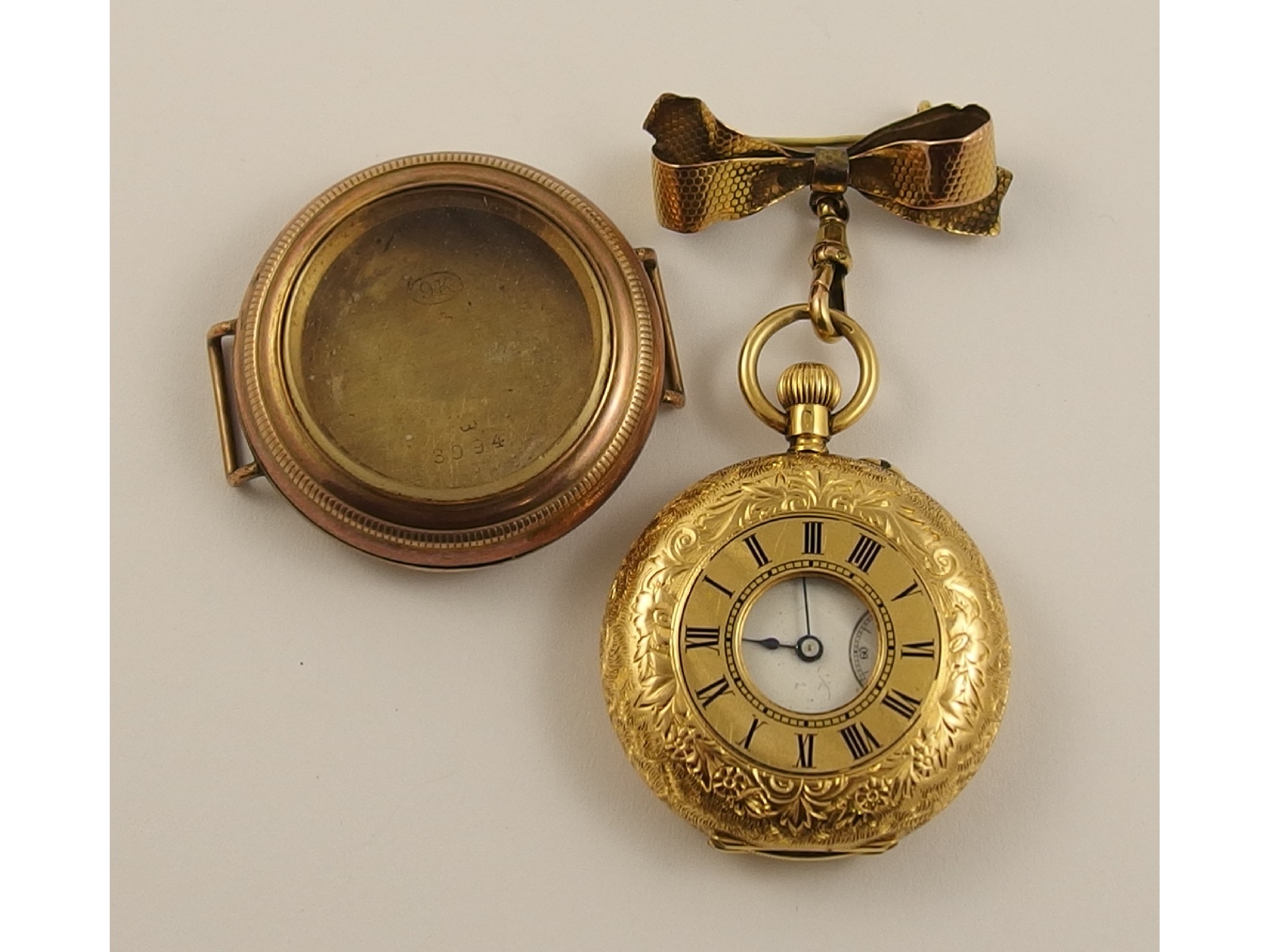 Appraisal: An ct fob watch with ct bow fob brooch and