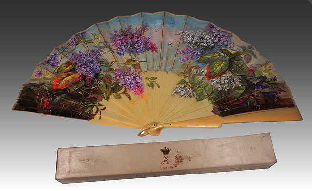 Appraisal: A FRENCH PAINTED PAPER AND IVORY FAN decorated lilac blossom