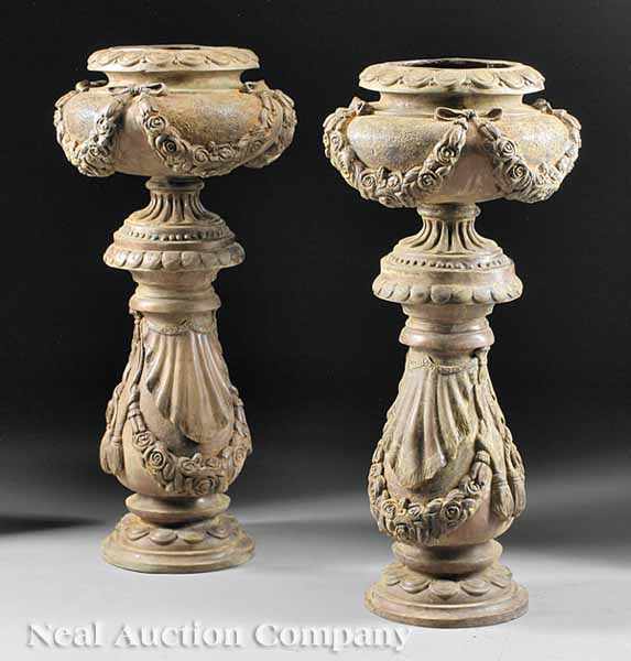 Appraisal: A Pair of Bronze Jardini res of urn form scalloped