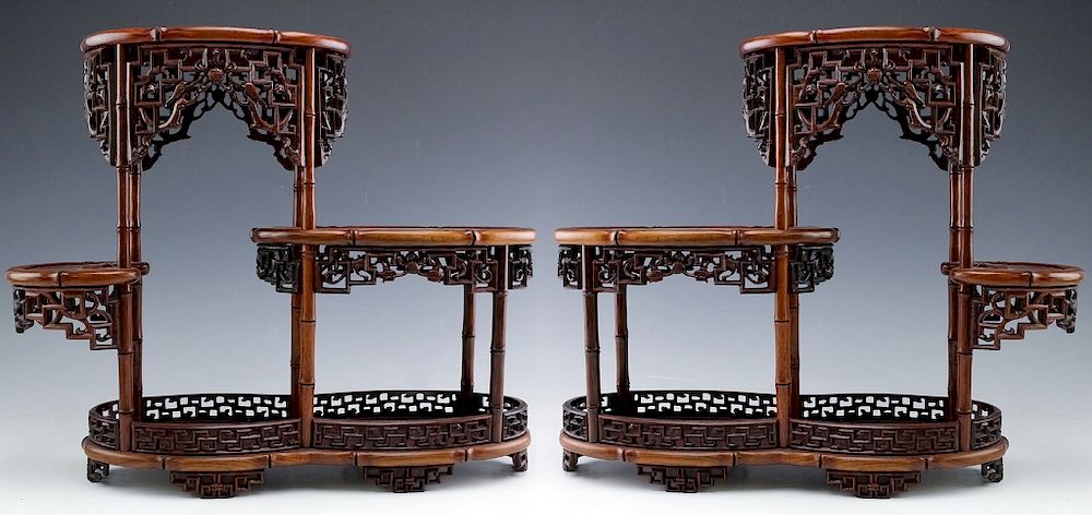 Appraisal: PAIR Chinese Carved Wood Reticulated Figure Stands Pair of carved