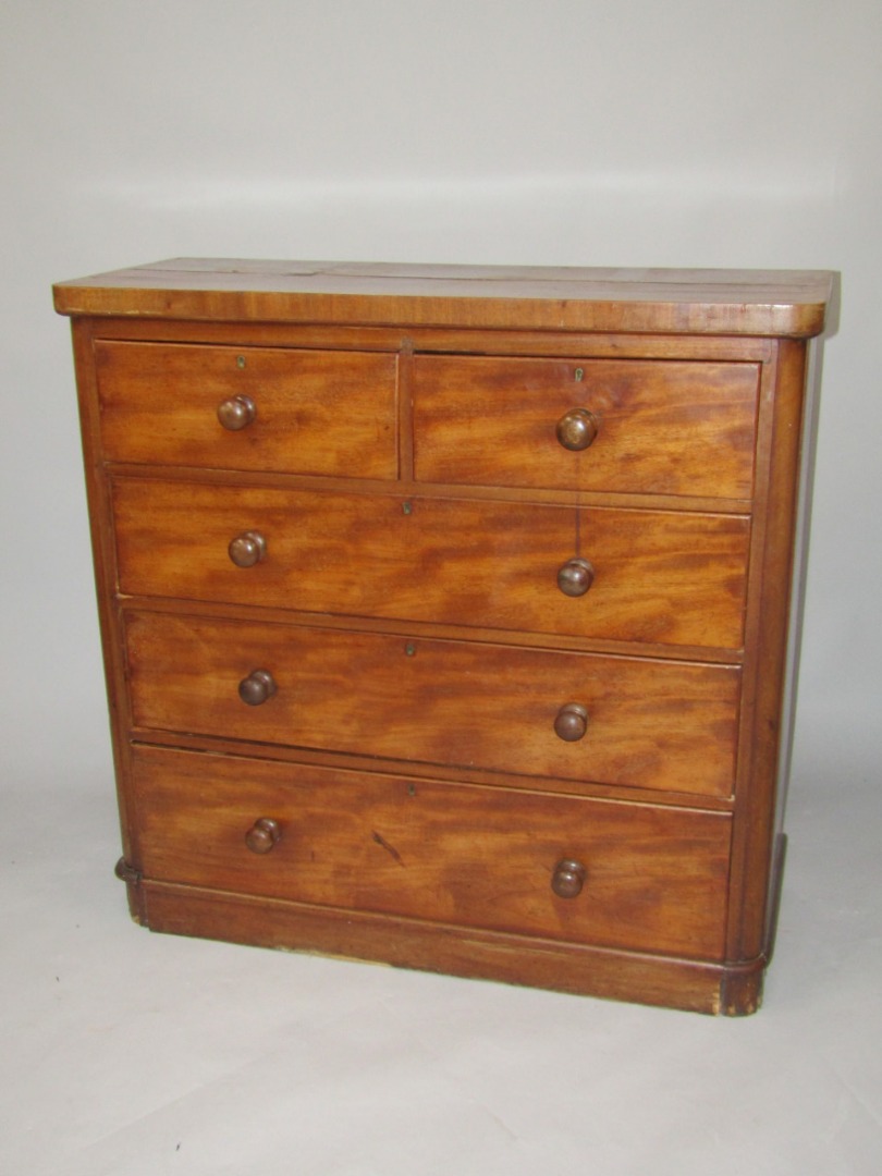 Appraisal: A Victorian mahogany chest of drawers two short and three