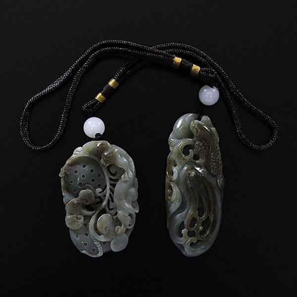 Appraisal: Chinese Jade Pendants Chinese th century Two celadon jade with