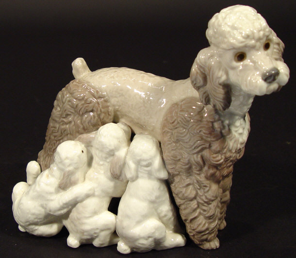 Appraisal: Lladro porcelain group of puppies feeding from their mother with