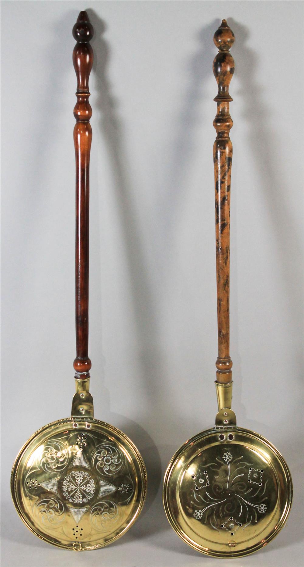 Appraisal: PAIR OF BRASS AND WOODEN HANDLE BEDWARMERS each with a