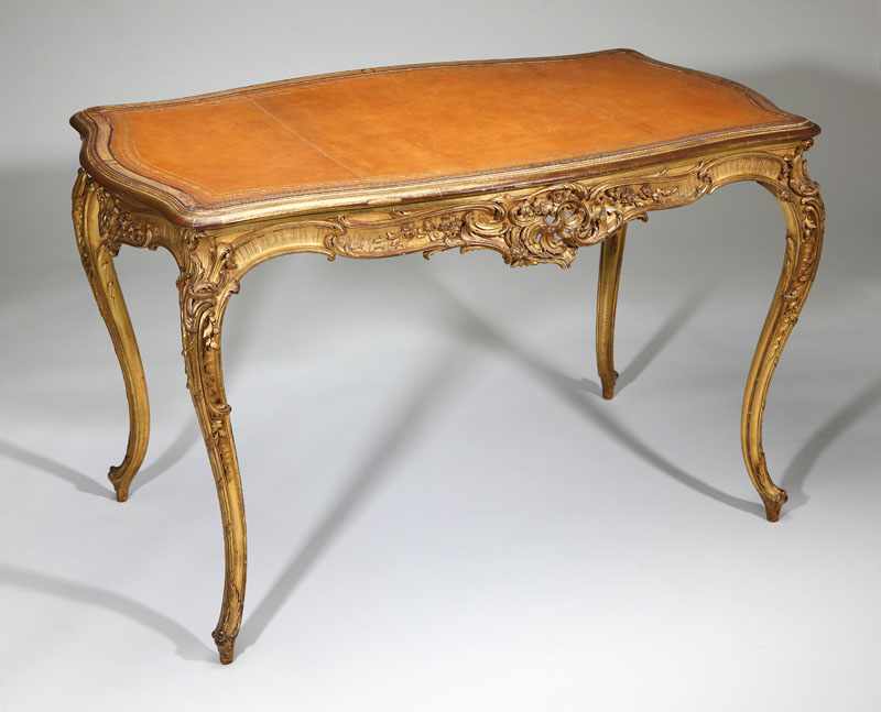 Appraisal: A Louis XV style giltwood table a ecrire Pihouee Guerin