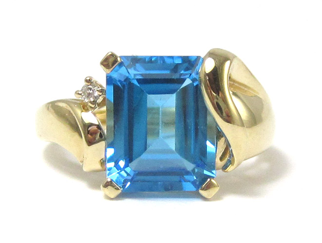 Appraisal: BLUE TOPAZ AND FOURTEEN KARAT GOLD RING set with one