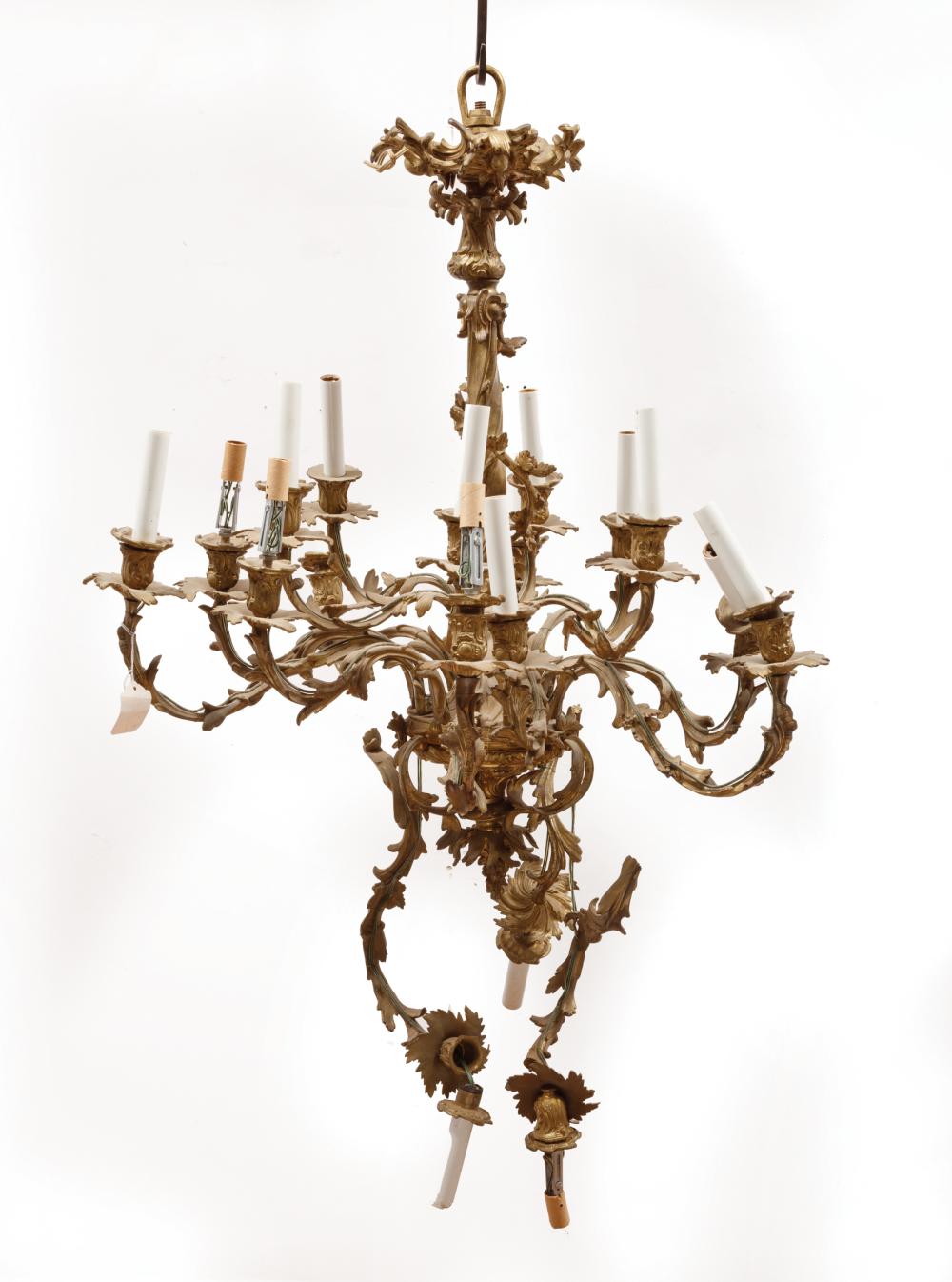 Appraisal: Louis XVI-Style Gilt Metal Twelve-Light Chandelier foliate wrapped stem four