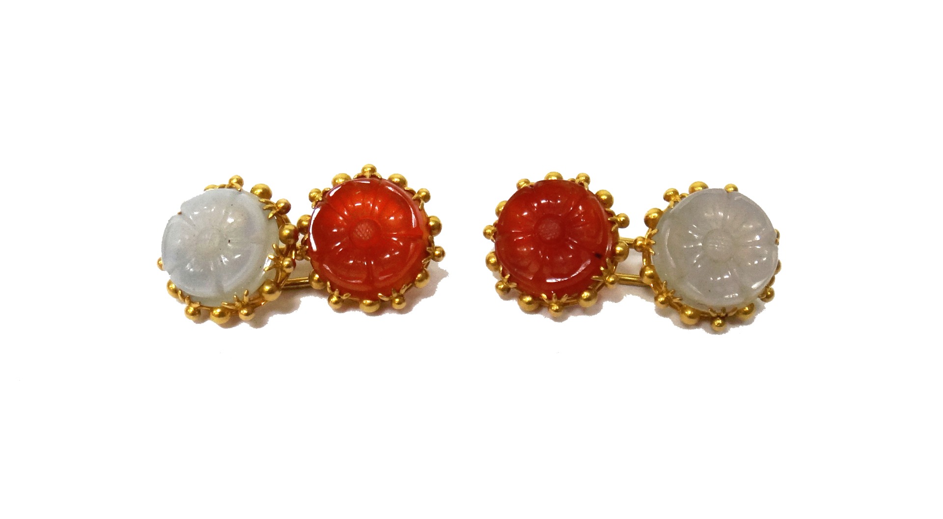 Appraisal: A pair of gold mounted carved cornelian and grey agate