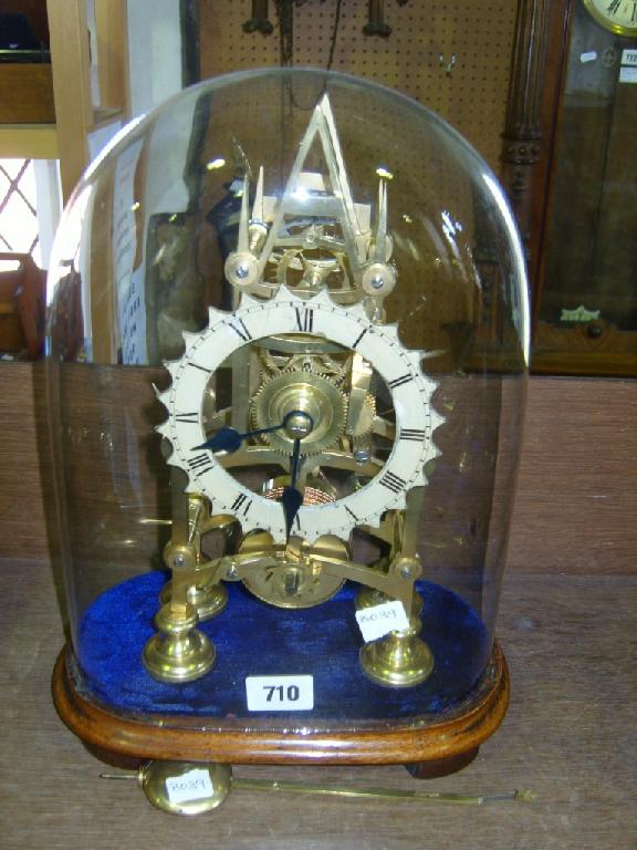 Appraisal: A th century brass single fusee skeleton clock beneath a