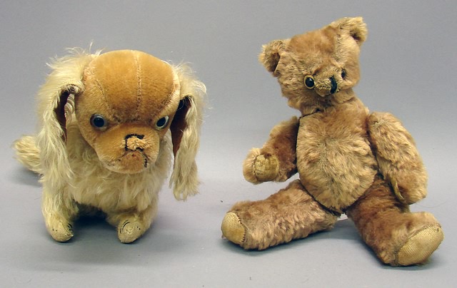 Appraisal: Pair of mohair animals Taupe bear with shoe button eyes