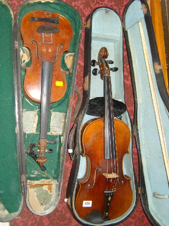 Appraisal: A cased violin and bow together with a further cased