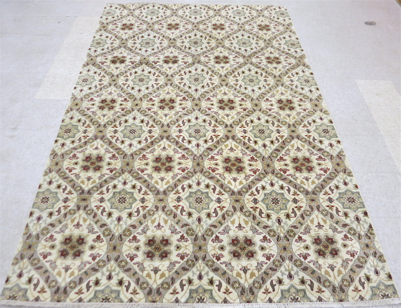 Appraisal: HAND KNOTTED ORIENTAL CARPET overall garden panel design on cream