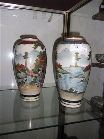 Appraisal: A PAIR OF SATSUMA VASES with figures in landscape decoration