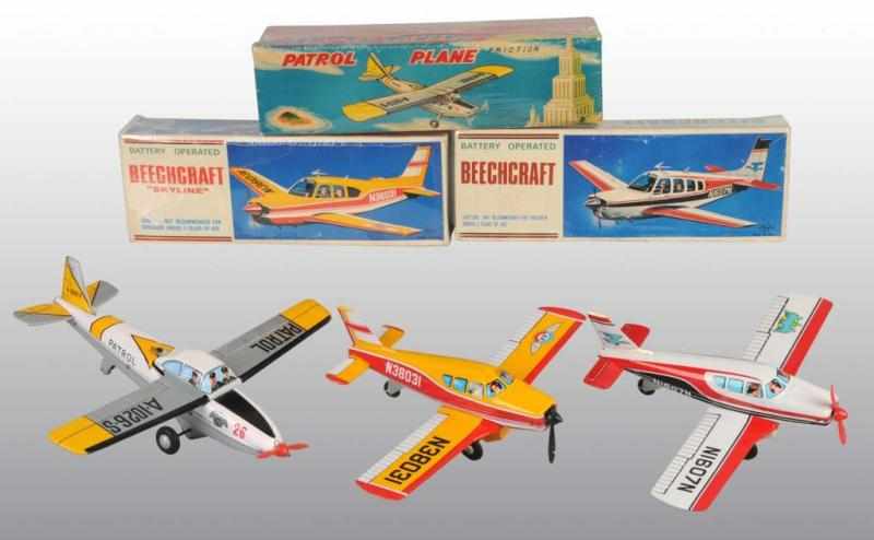 Appraisal: Lot of Tin Patrol Airplane Toys Description Japanese Working Includes