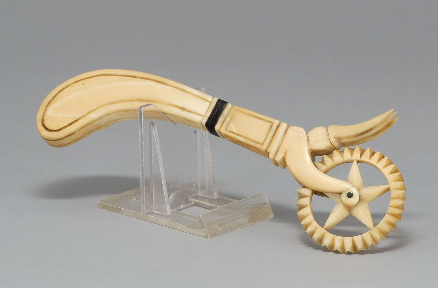 Appraisal: WHALE IVORY JAGGING WHEEL WITH CRIMPING FORK Mid- th CenturyNot