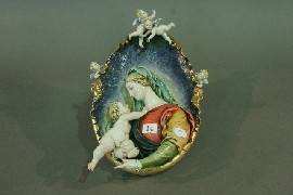 Appraisal: A 'Capo-di-monte' wall plaque of Madonna child