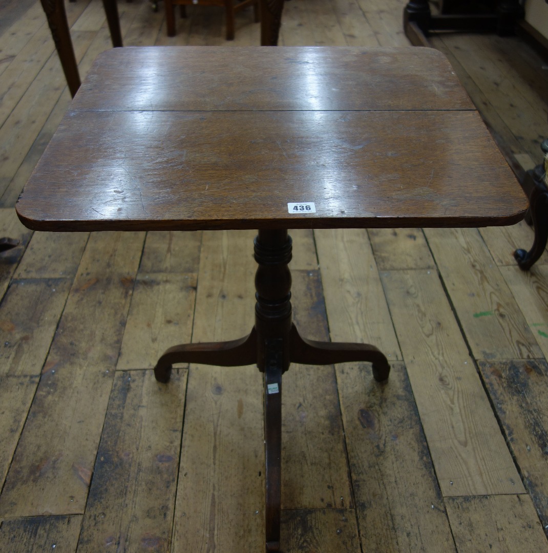 Appraisal: A George III oak pedestal table the square tilt-top on