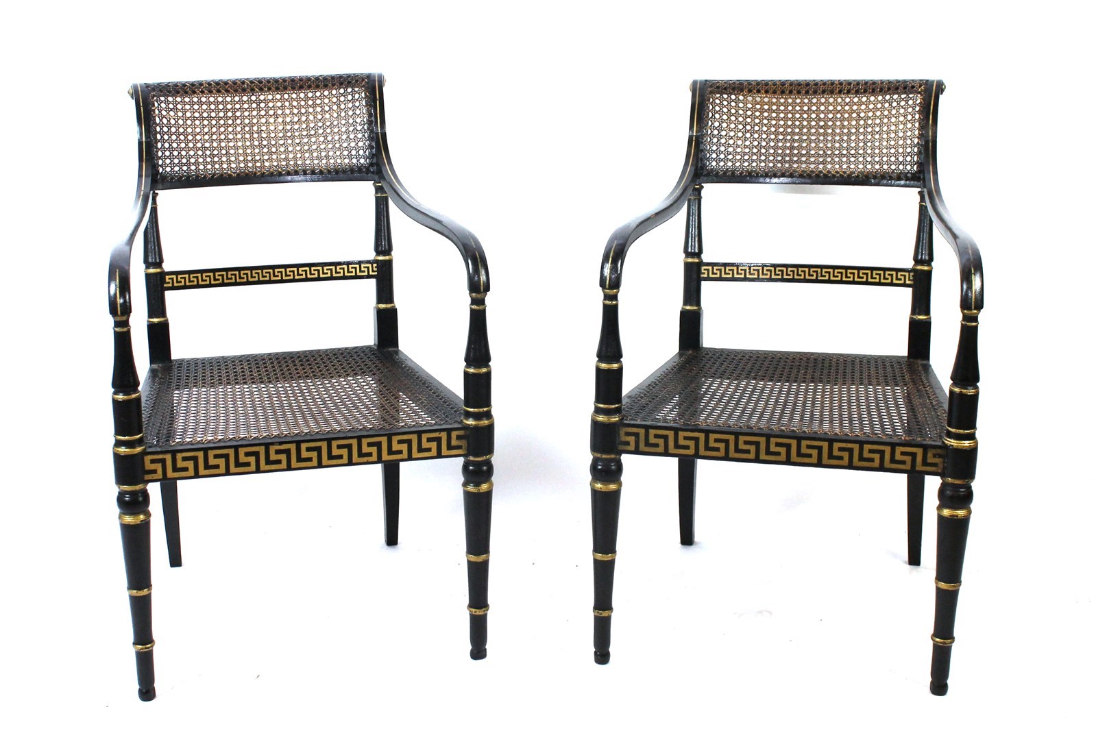 Appraisal: A pair of Regency parcel gilt ebonised open armchairs with