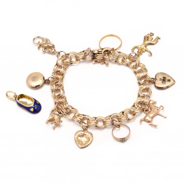 Appraisal: Gold Charm Bracelet with Charms The gold link charm bracelet