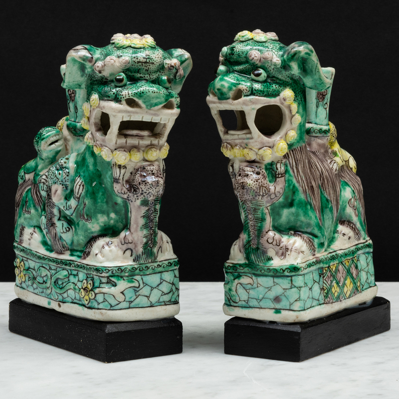 Appraisal: Two Similar Chinese Aubergine Green and Yellow Glazed Porcelain Buddhistic