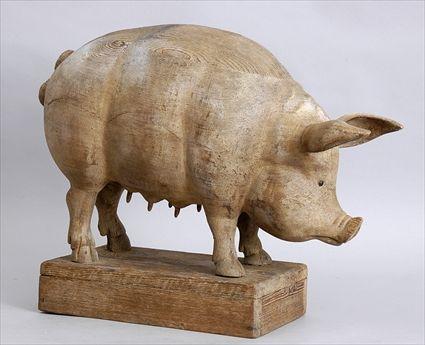 Appraisal: CARVED WOOD FIGURE OF A SOW Standing four square with