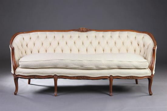 Appraisal: FRENCH LOUIS XV STYLE FRUITWOOD CANAPE th century Cabriole-form sofa