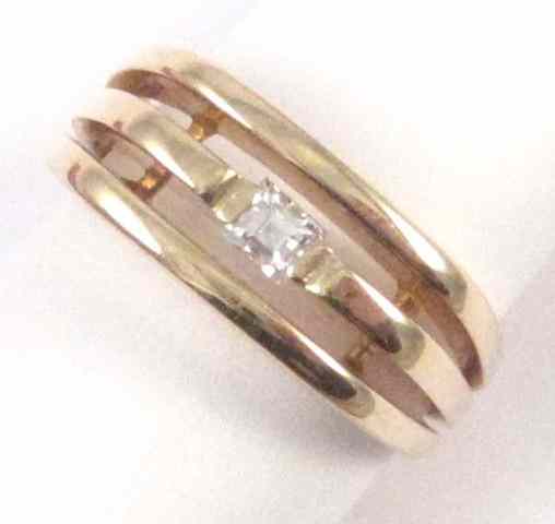 Appraisal: DIAMOND AND FOURTEEN KARAT GOLD RING set with a rectangular