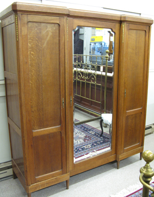 Appraisal: LOUIS XVI STYLE THREE-DOOR OAK ARMOIRE Continental early th century