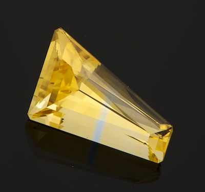 Appraisal: An Unmounted Bi-Color Citrine Freeform artisan cut citrine of yellow