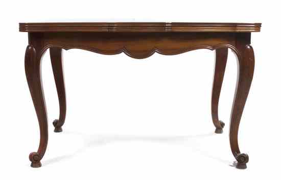 Appraisal: A Louis XV Style Fruitwood Extension Table having a shaped