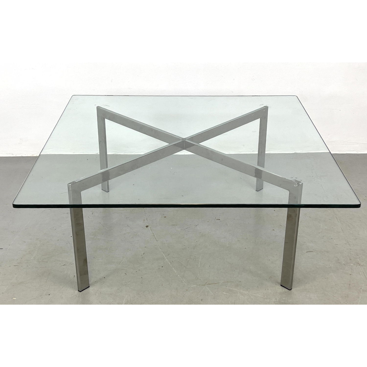 Appraisal: Knoll Style coffee table Chrome X Base supports Thick Square