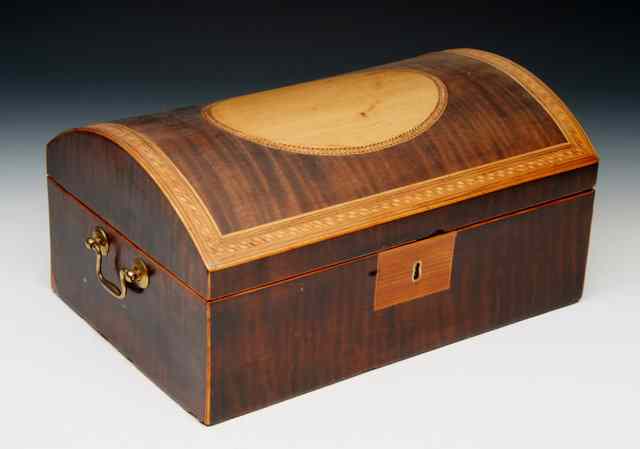 Appraisal: A GEORGIAN FIDDLE PATTERN MAHOGANY WORKBOX the domed hinged lid