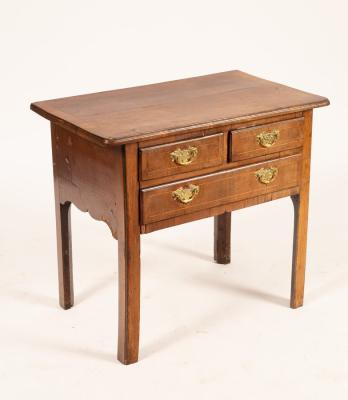 Appraisal: A mid th Century walnut lowboy the crossbanded rectangular top