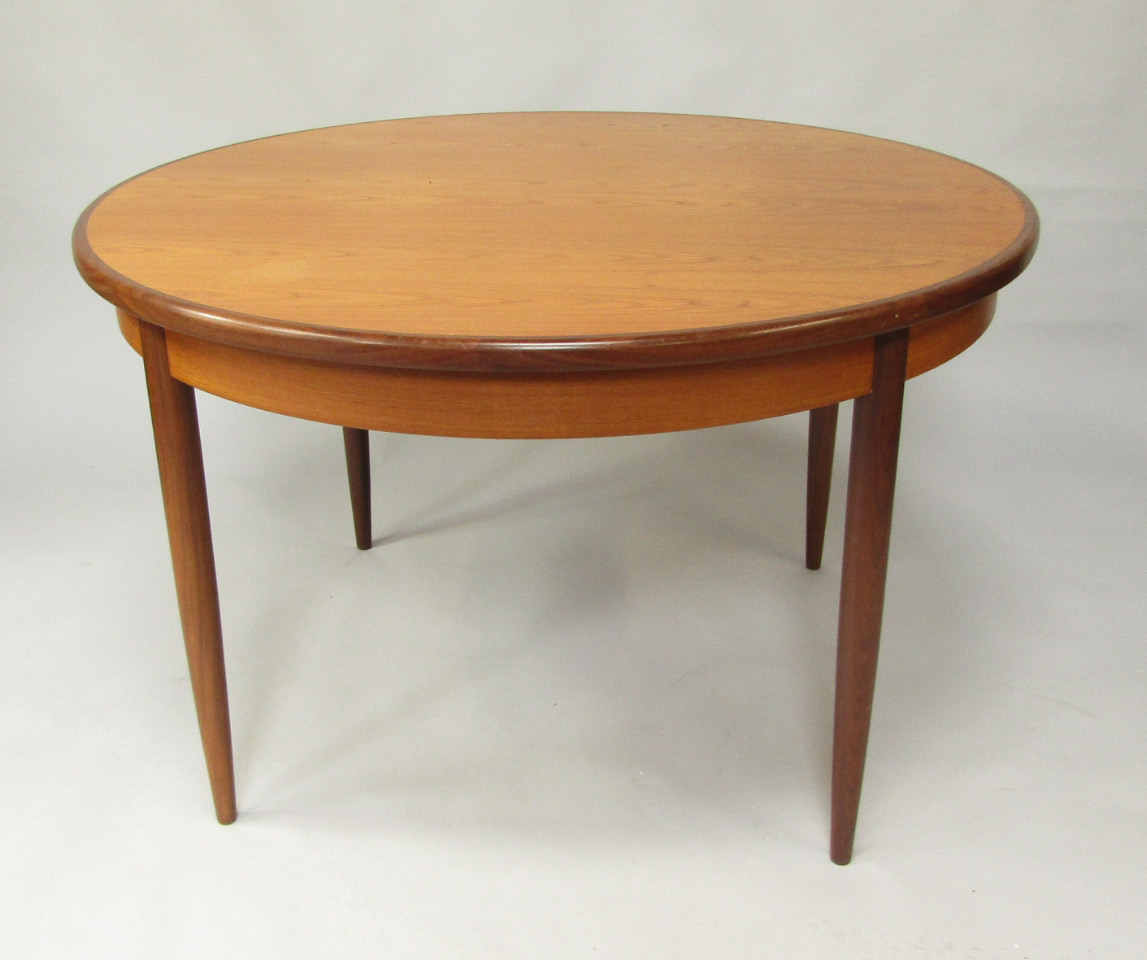 Appraisal: A G-Plan teak draw leaf dining table with one additional