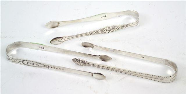 Appraisal: PAIR OF GEORGE III SILVER BRIGHT-CUT SUGAR TONGS STEPHEN ADAMS