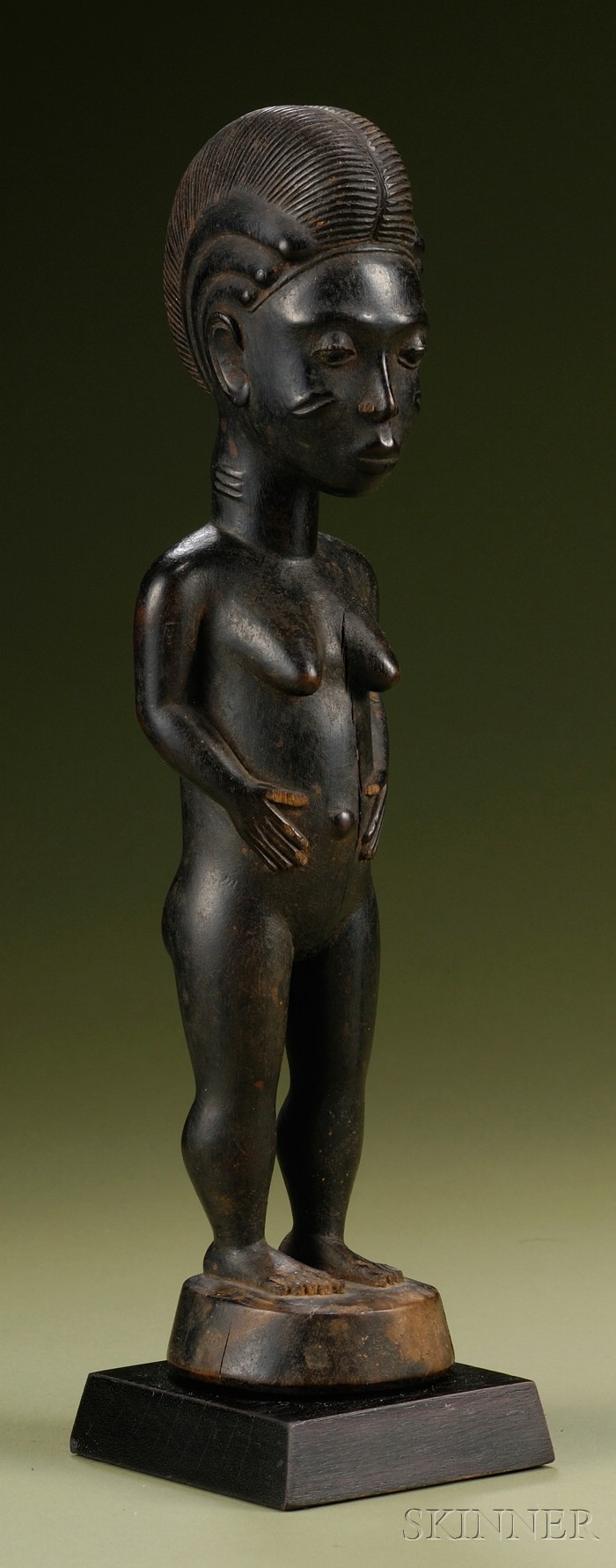 Appraisal: African Carved Wood Female Figure Baule standing on round base