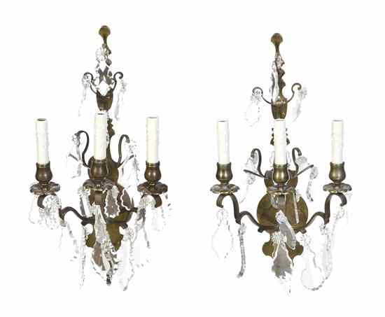 Appraisal: A Pair of Continental Gilt Metal Three-Light Sconces each having