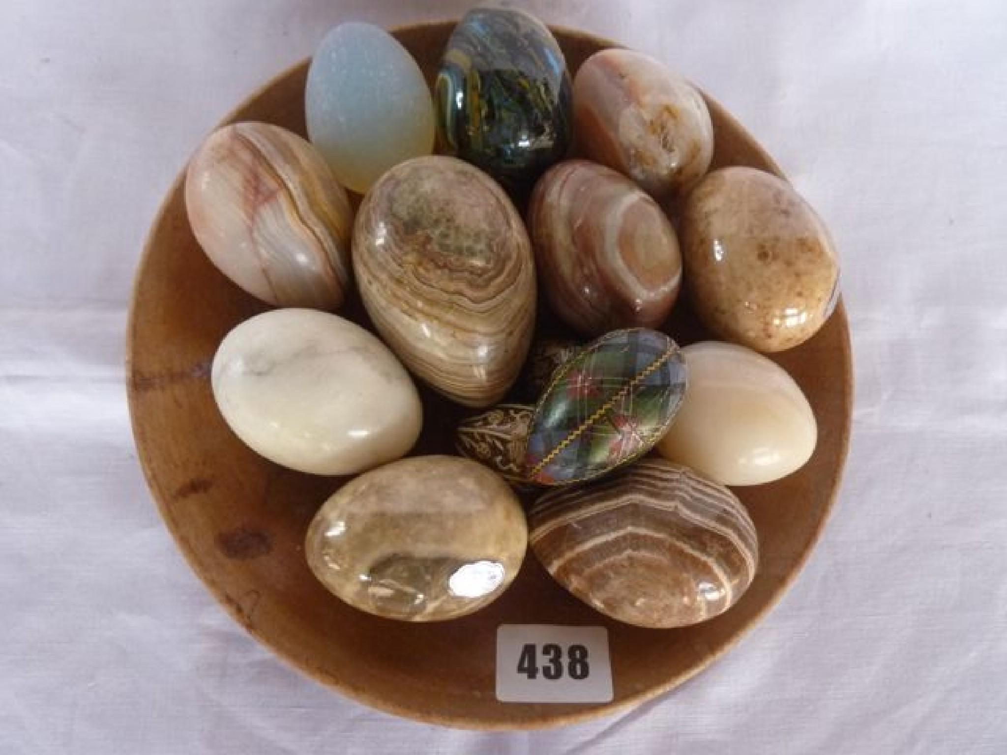 Appraisal: A polished timber bowl containing a selection of agate eggs