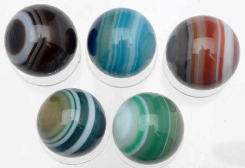 Appraisal: Lot of Dyed Bullseye Agate Marbles Hand faceted dyed Agate