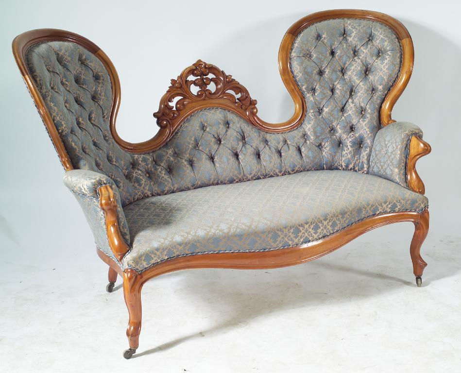 Appraisal: VICTORIAN DOUBLE SPOON BACK DEEP-BUTTONED SOFA the back carved with