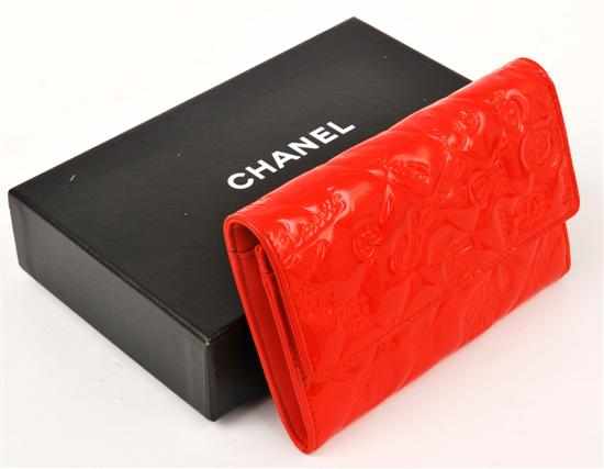 Appraisal: A WALLET BY CHANEL Styled in quilted strawberry coloured patent