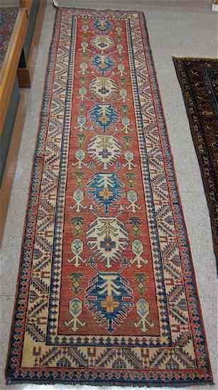 Appraisal: HAND KNOTTED ORIENTAL RUNNER Pakistani-Caucasian ' '' x ' ''