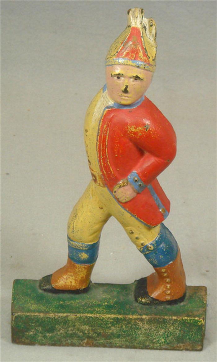 Appraisal: Cast iron doorstop large Prussian soldier in full uniform on