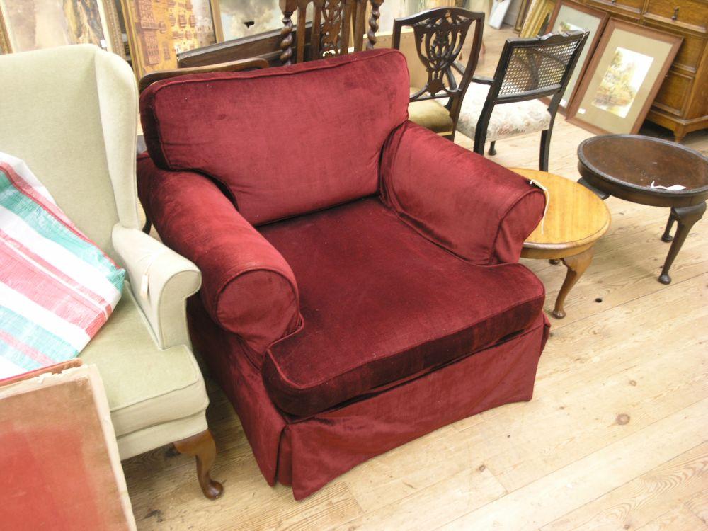 Appraisal: A Laura Ashley armchair upholstered in calico with deep burgundy